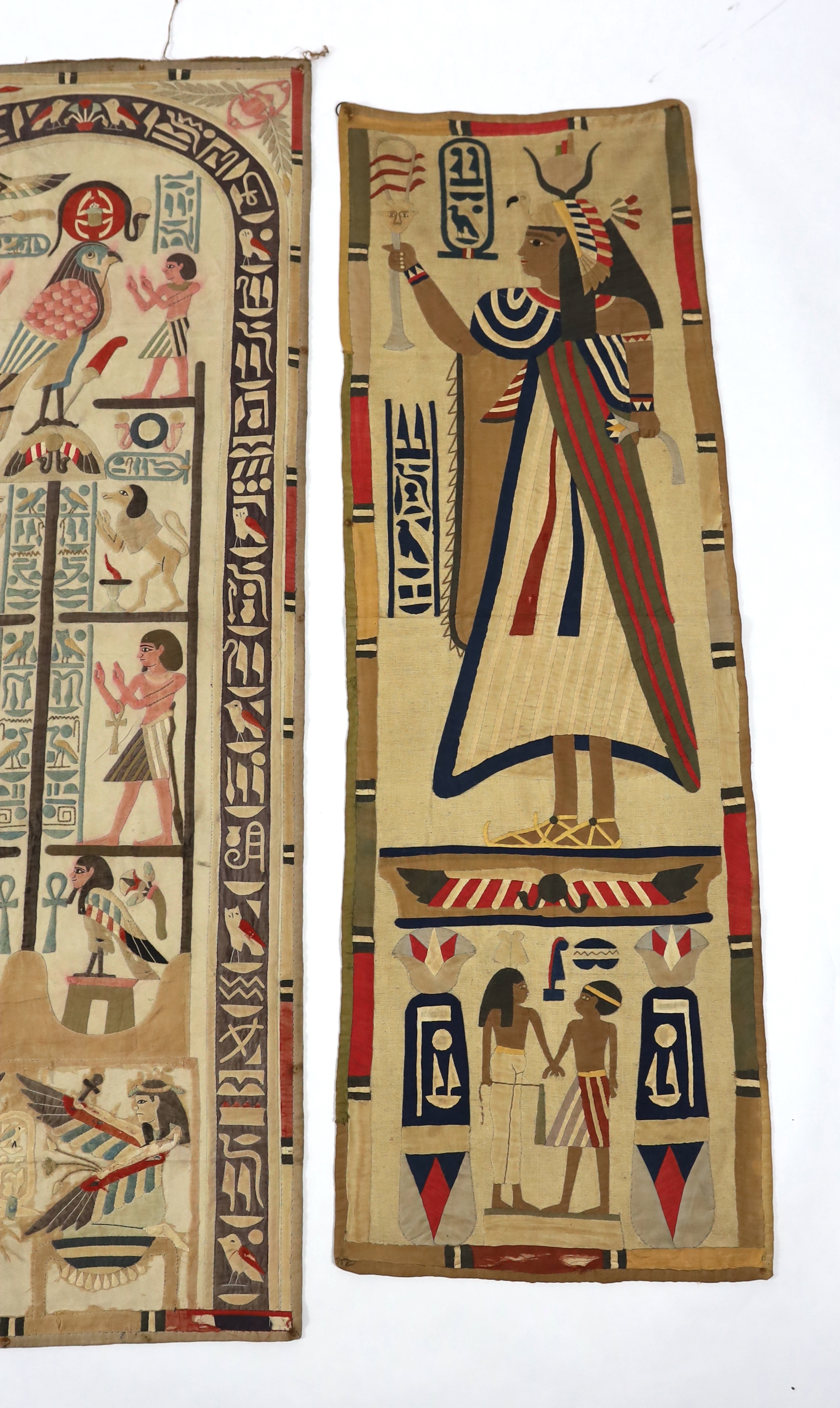 Four 1930’s Egyptian appliqué wall panels, (a pair and two single panels), decorated with various hieroglyphs, Gods and Pharaohs, the panels made for the European market experiencing an Egyptian revival after the discove